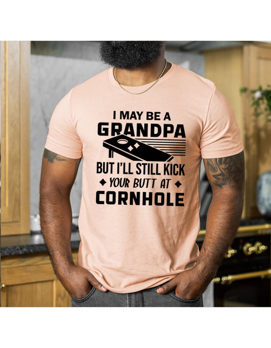I May Be A Grandpa But I Can Still Kick Your Butt In Cornhole Graphic T-Shirt