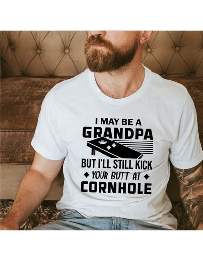 I May Be A Grandpa But I Can Still Kick Your Butt In Cornhole Graphic T-Shirt